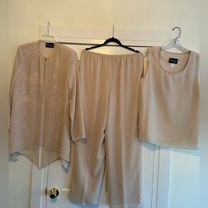 Never worn! 3 piece spectates. Wide legged pants with top and embellished jacket
